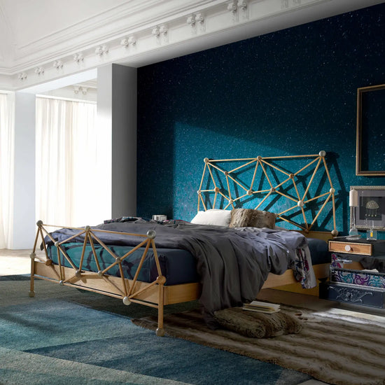 Cama Átomos integrada en dormitorio contemporáneo mostrando su estructura artesanal y acabados en madera.