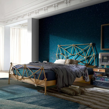 Cama Átomos integrada en dormitorio contemporáneo mostrando su estructura artesanal y acabados en madera.