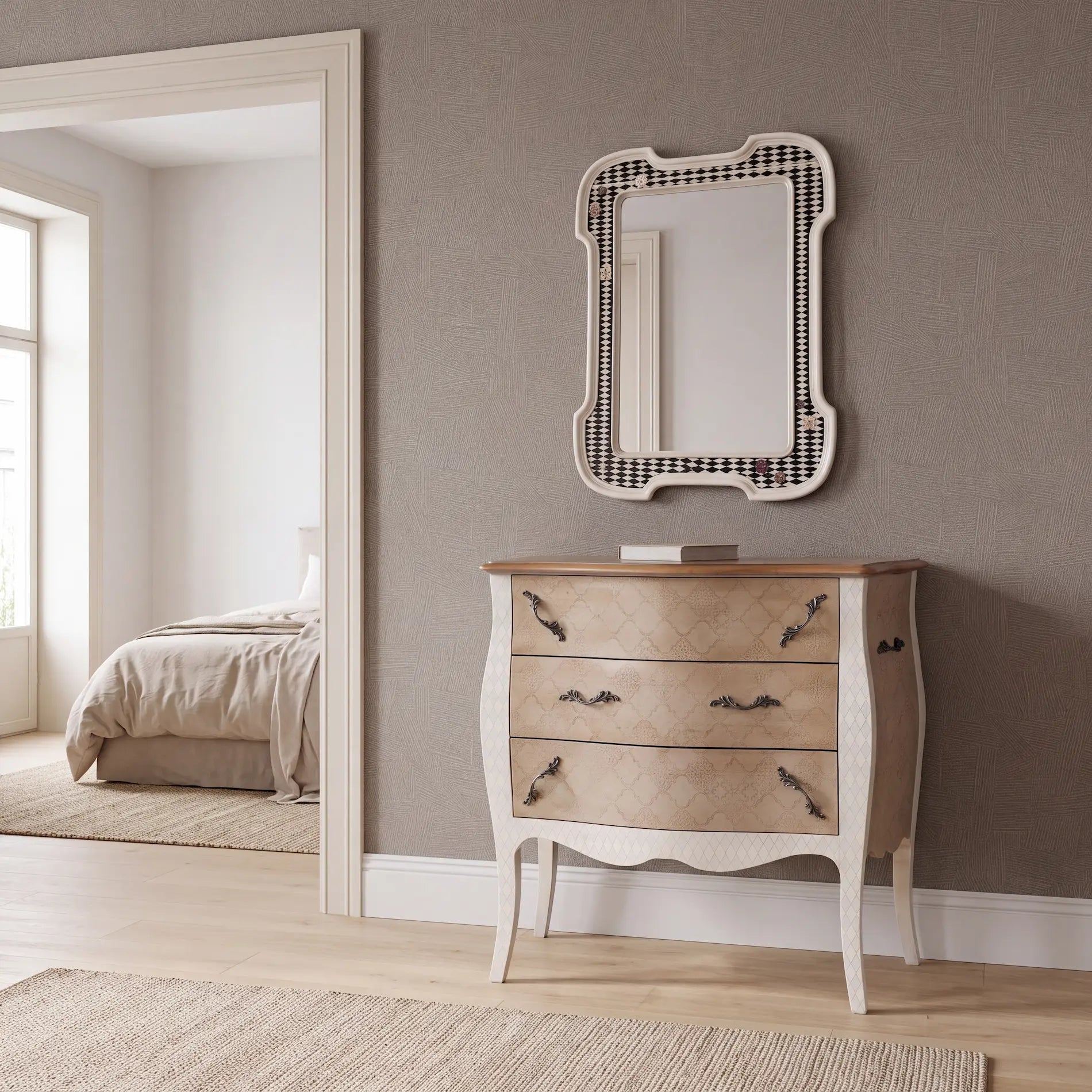 Cómoda Terilia ambientada junto a un dormitorio de tonos neutros y decoración serena.
