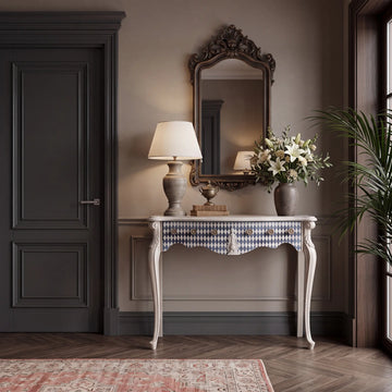 Consola Vita ambientada en un recibidor elegante con espejo, lámpara y composición floral.