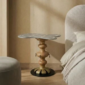 Mesita decorativa con silueta curva, ideal para romper la monotonía de líneas rectas.